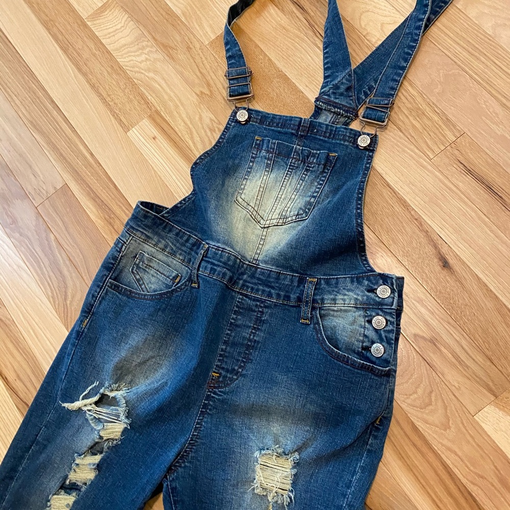 Distressed overalls with stretch